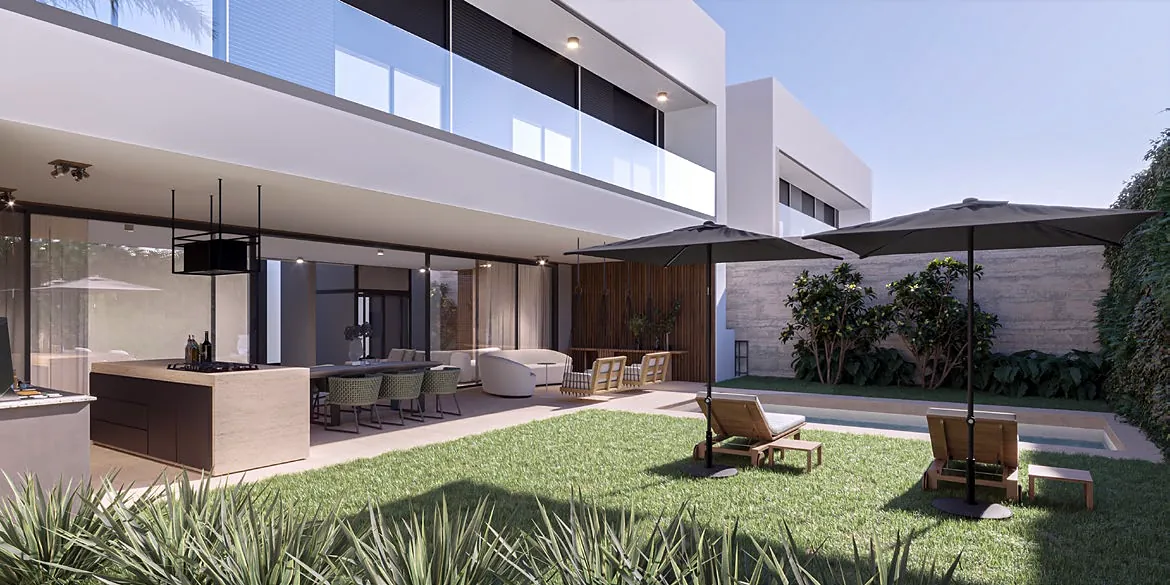 Gourmet kitchen with an island, opening onto the garden and the deck