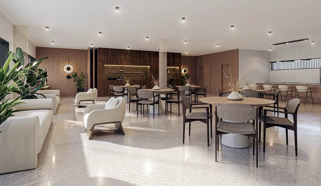 Party room with tables, armchairs and a support kitchen